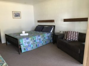 Toogoolawah Motel room with bed and couch