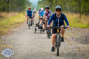 A group of bike riders riding on the Brisbane Valley Rail Trail.