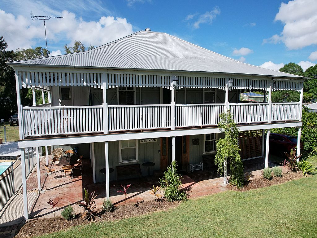 Side view of the two story Montrose on Moore Queenslander house.