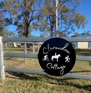 Clarendon Cottage sign on the front fence of the country property.