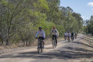 An image of cyclists on a rail trail