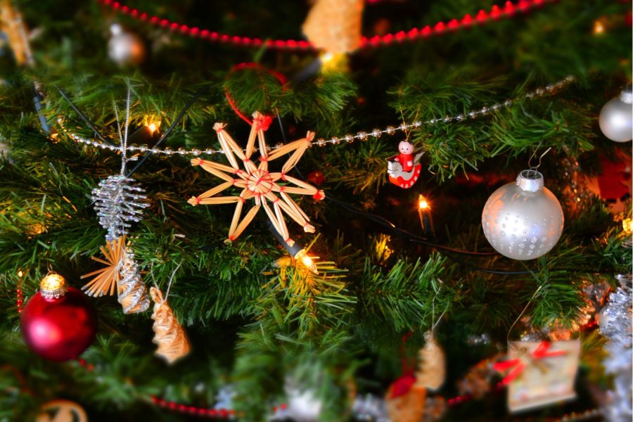 Christmas decorations hanging on a christmas tree.