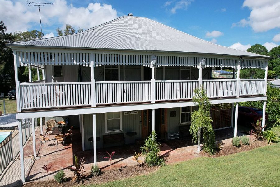 Side view of the two story Montrose on Moore Queenslander house.