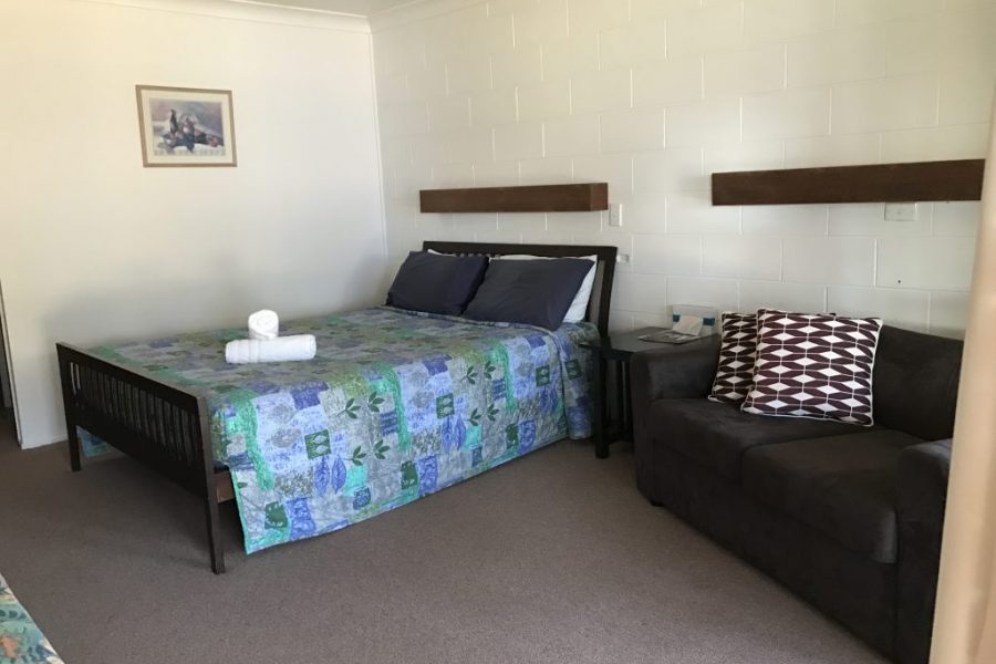 Toogoolawah Motel room with bed and couch