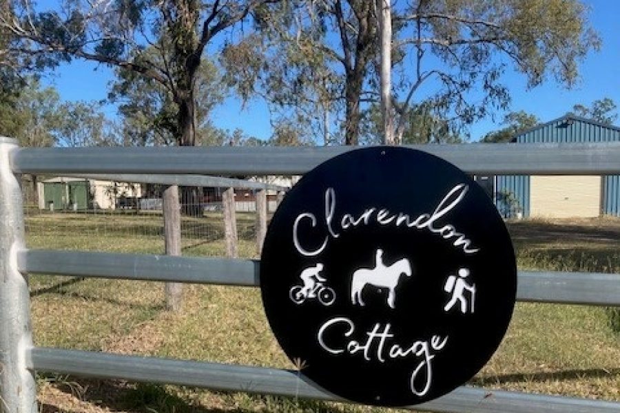 Clarendon Cottage sign on the front fence of the country property.